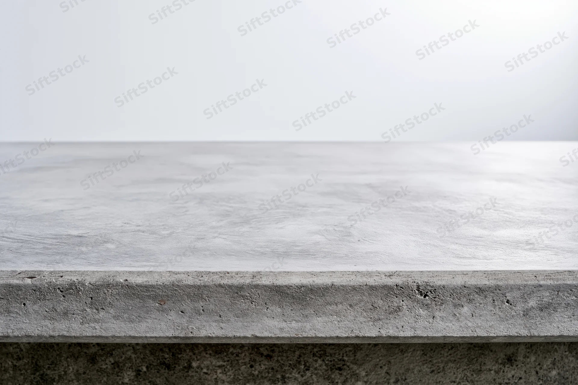 Empty concrete tabletop viewed straight on from low angle with copyspace above
