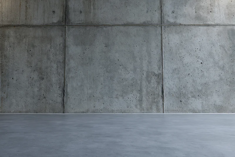 Empty concrete wall and floor interior with grid pattern and copyspace