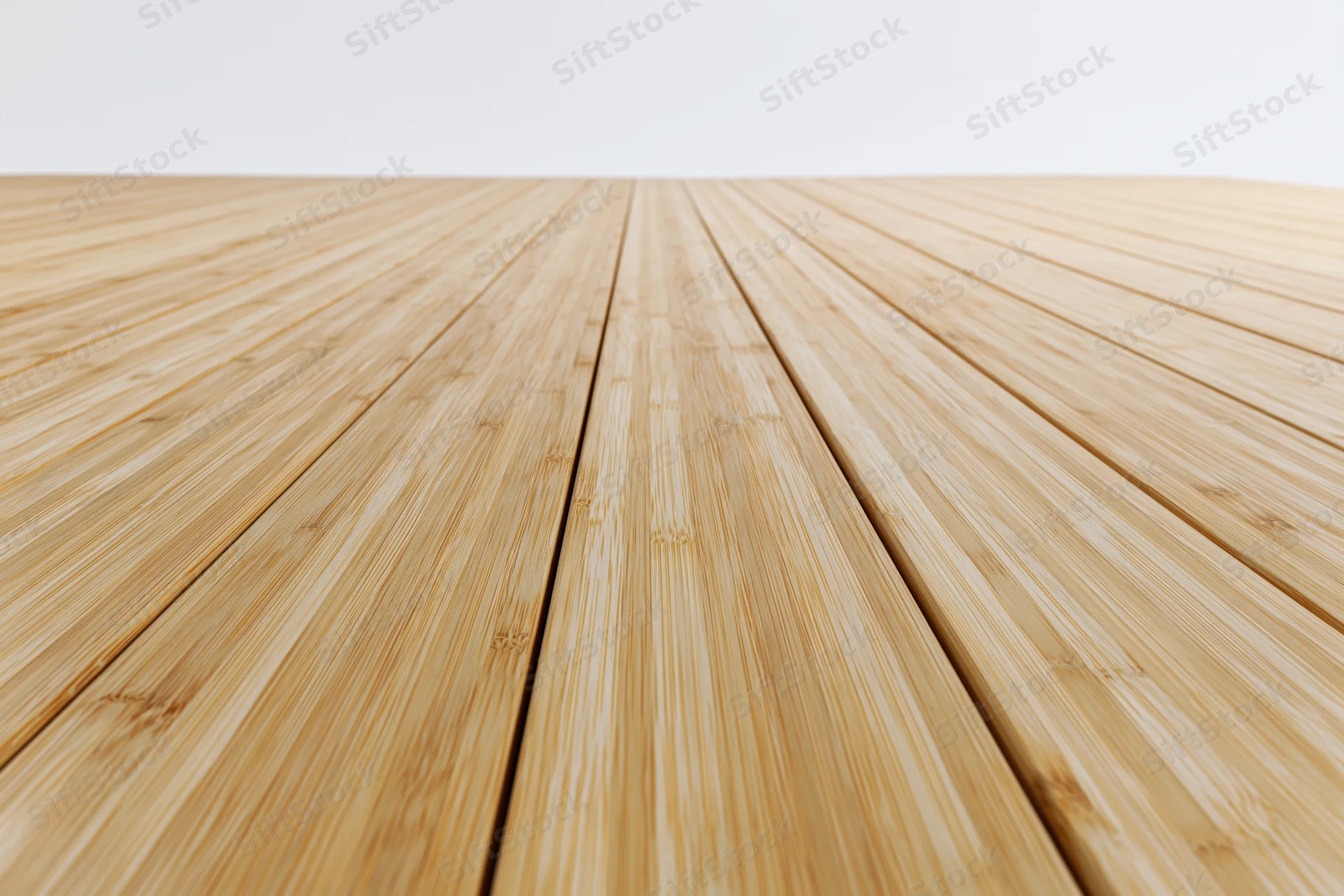 Light bamboo wood planks arranged in perspective on a floor surface