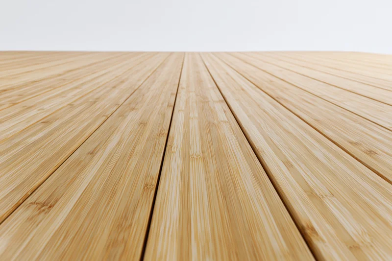 Light bamboo wood planks arranged in perspective on a floor surface