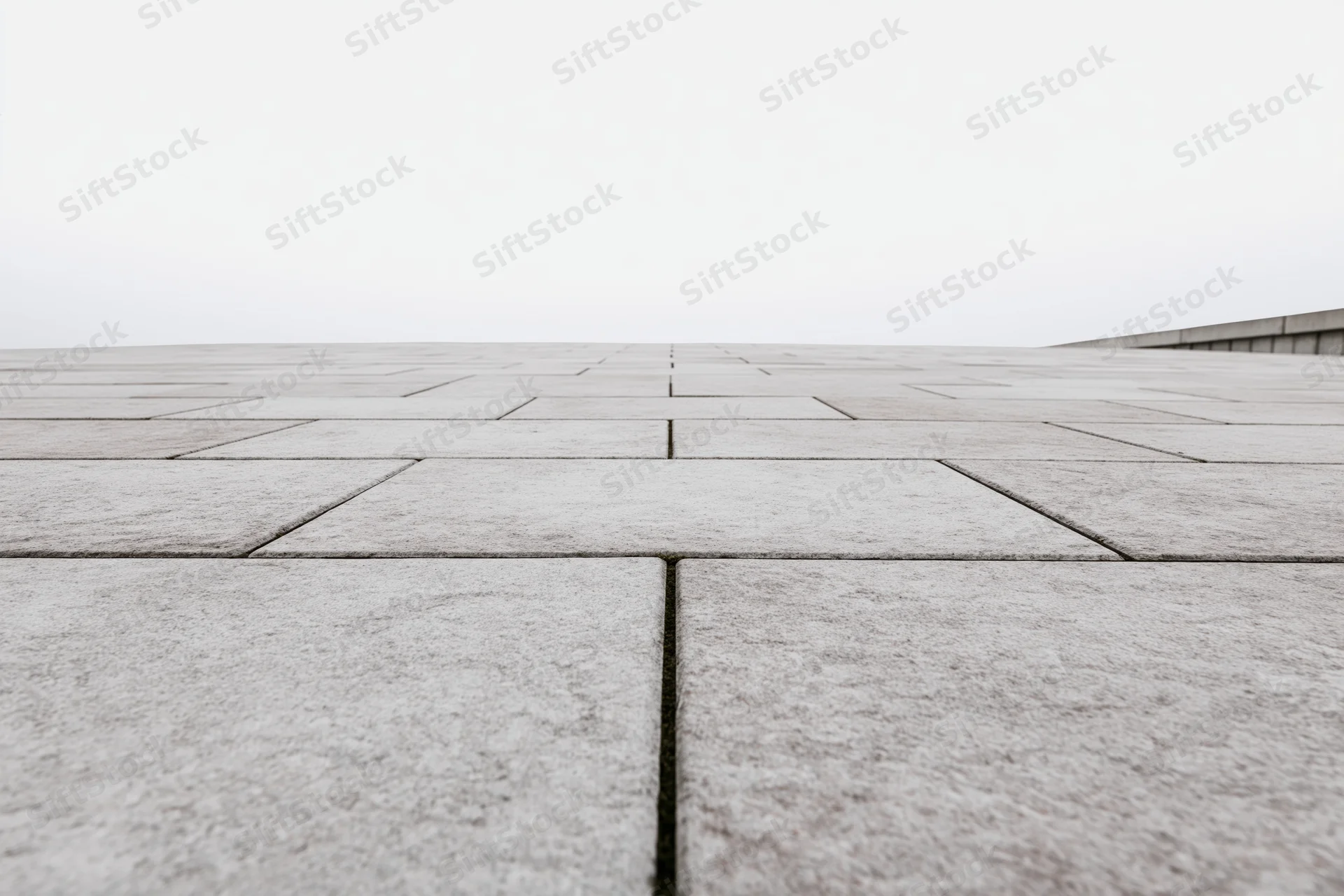 Stone tile plaza floor stretching to the horizon outdoors