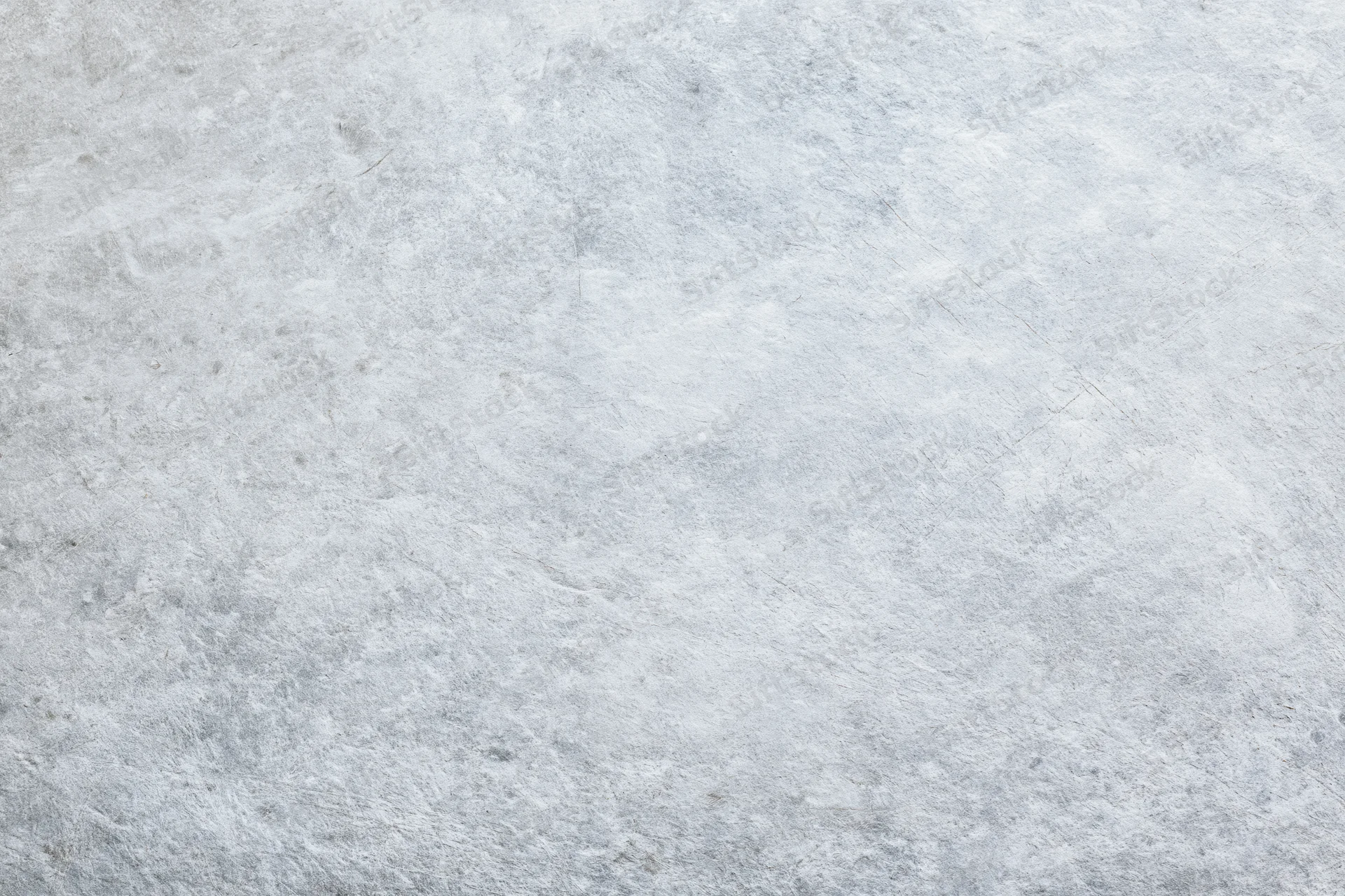 Flat gray concrete surface filling the frame as a textured background