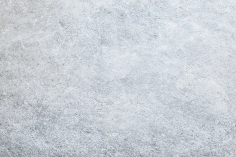 Flat gray concrete surface filling the frame as a textured background