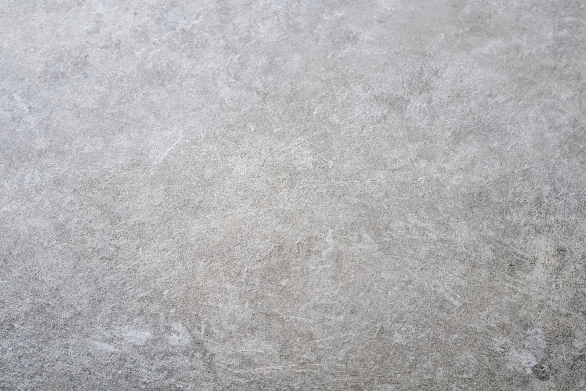 Flat concrete surface filling the frame as a neutral background
