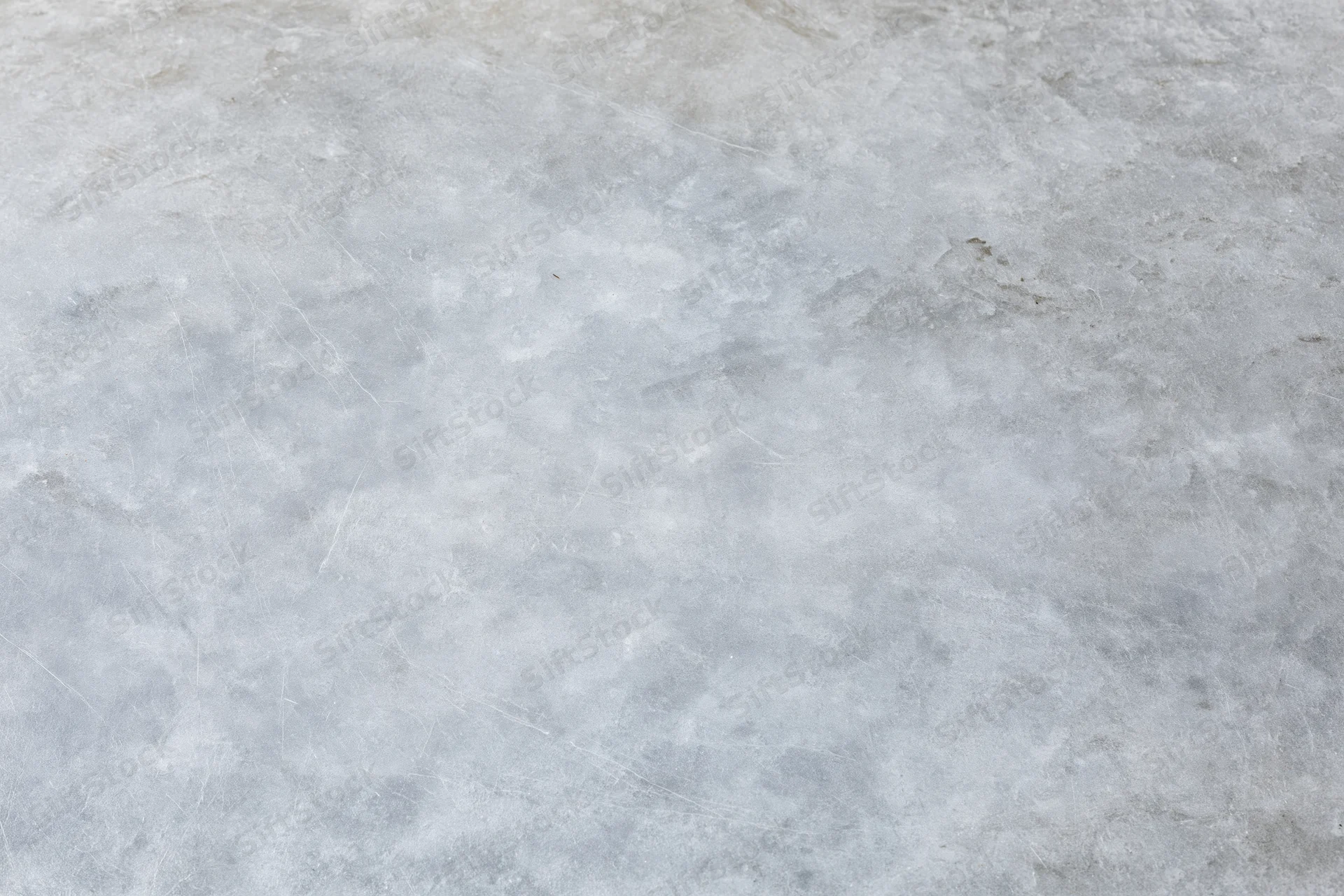 Flat gray concrete surface filling the frame as a textured background
