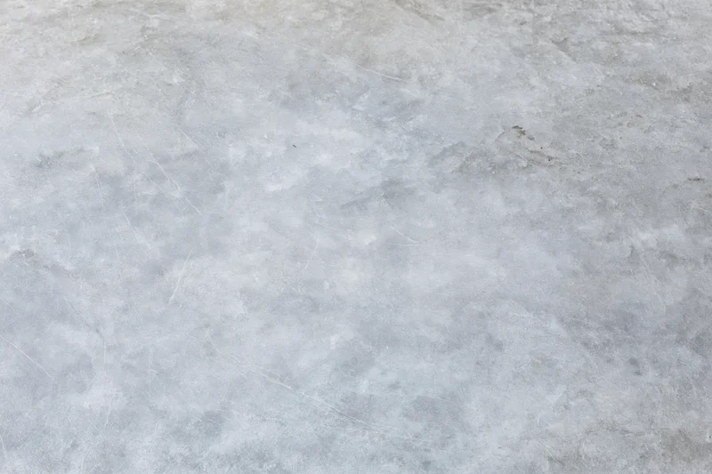 Flat gray concrete surface filling the frame as a textured background