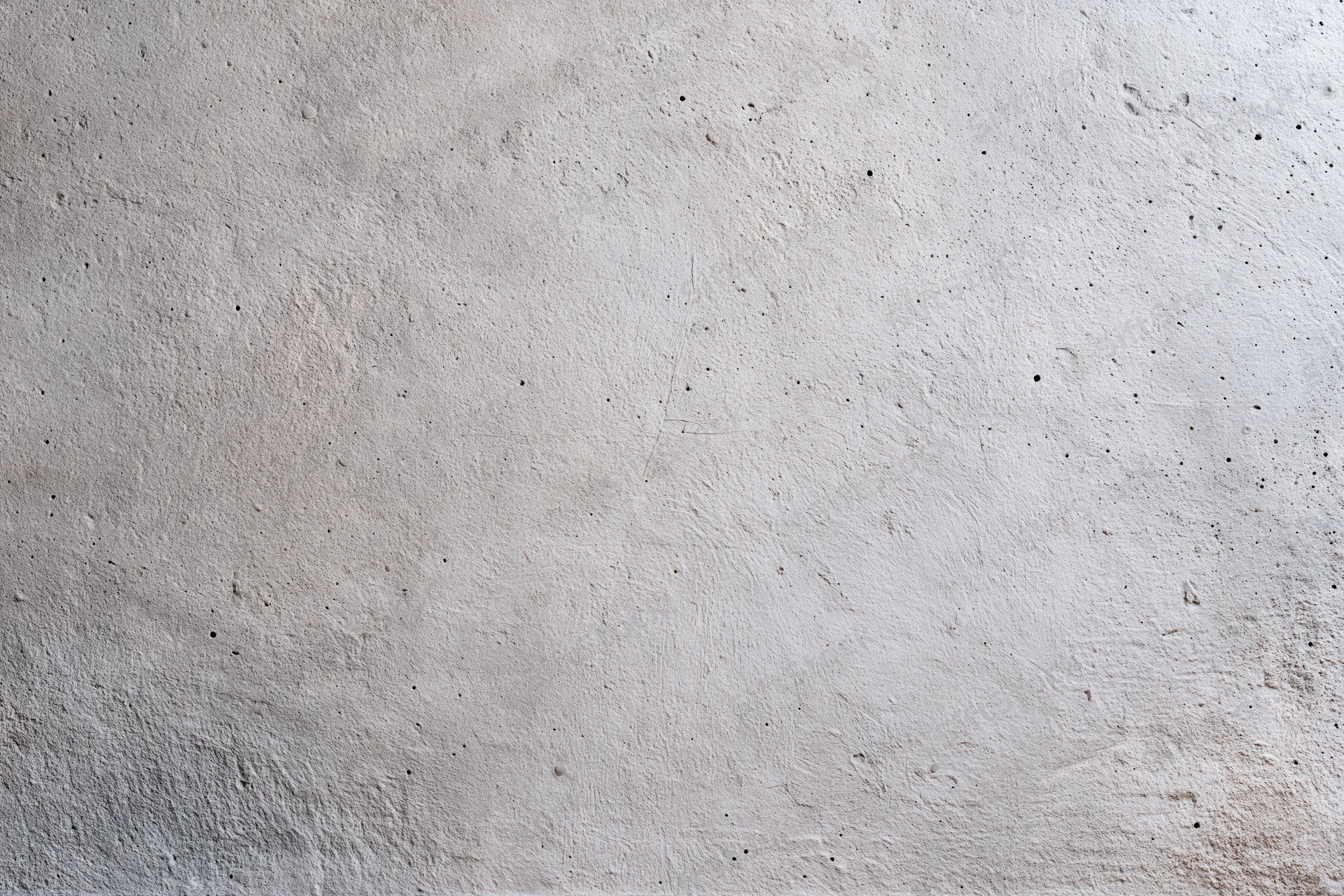Flat concrete wall surface filling the frame with rough texture and gray tone
