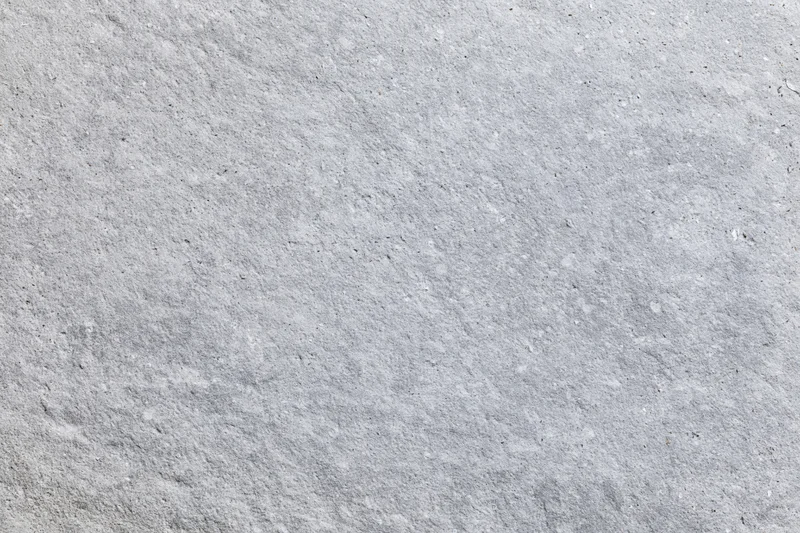 Flat concrete surface filling the frame with rough texture and gray tone