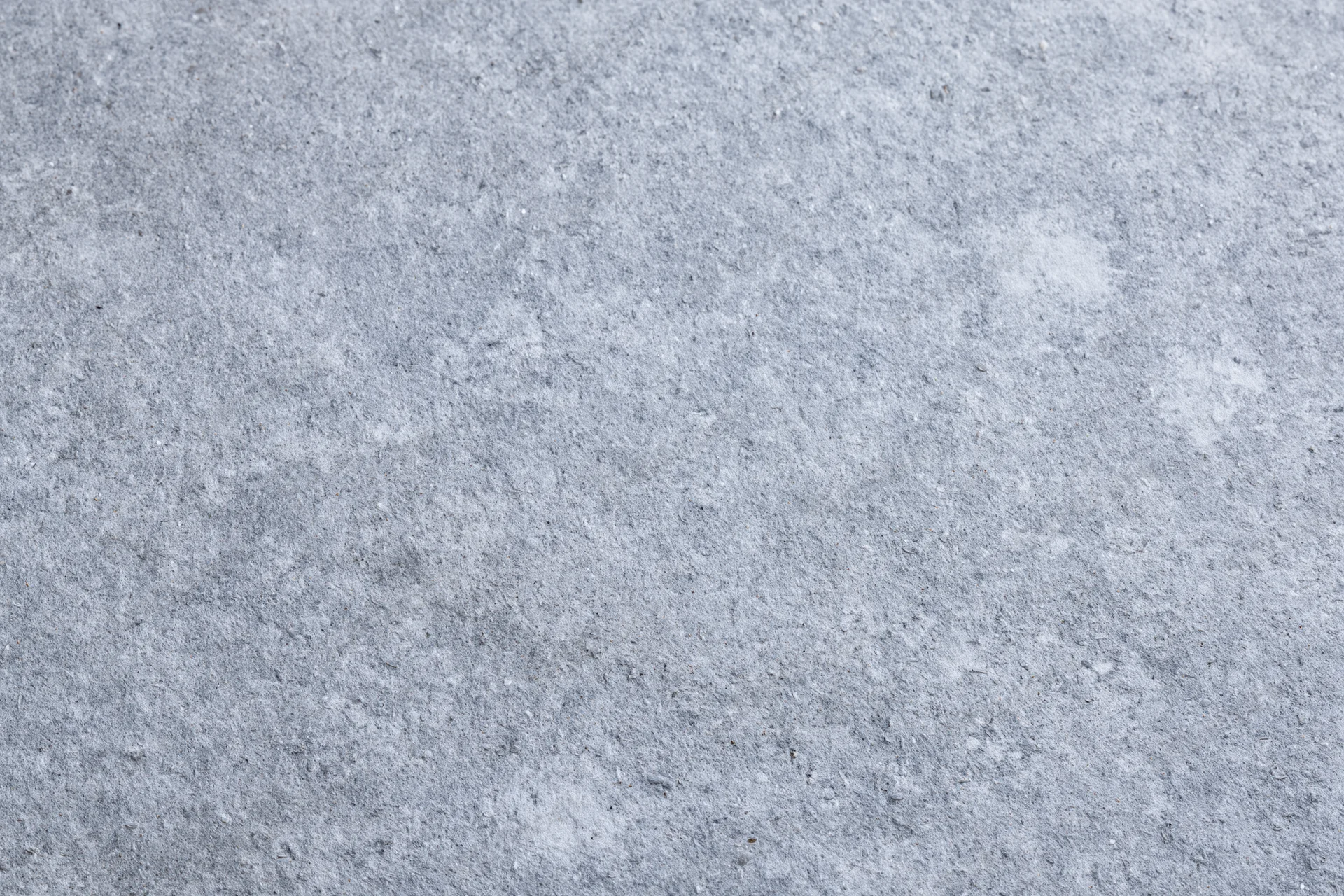 Flat concrete surface texture filling the frame edge to edge