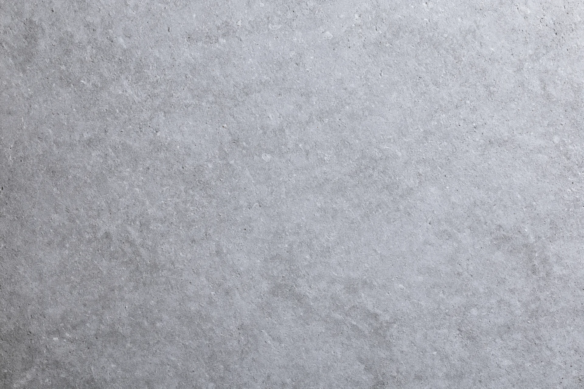Flat concrete surface texture filling the frame as a seamless background