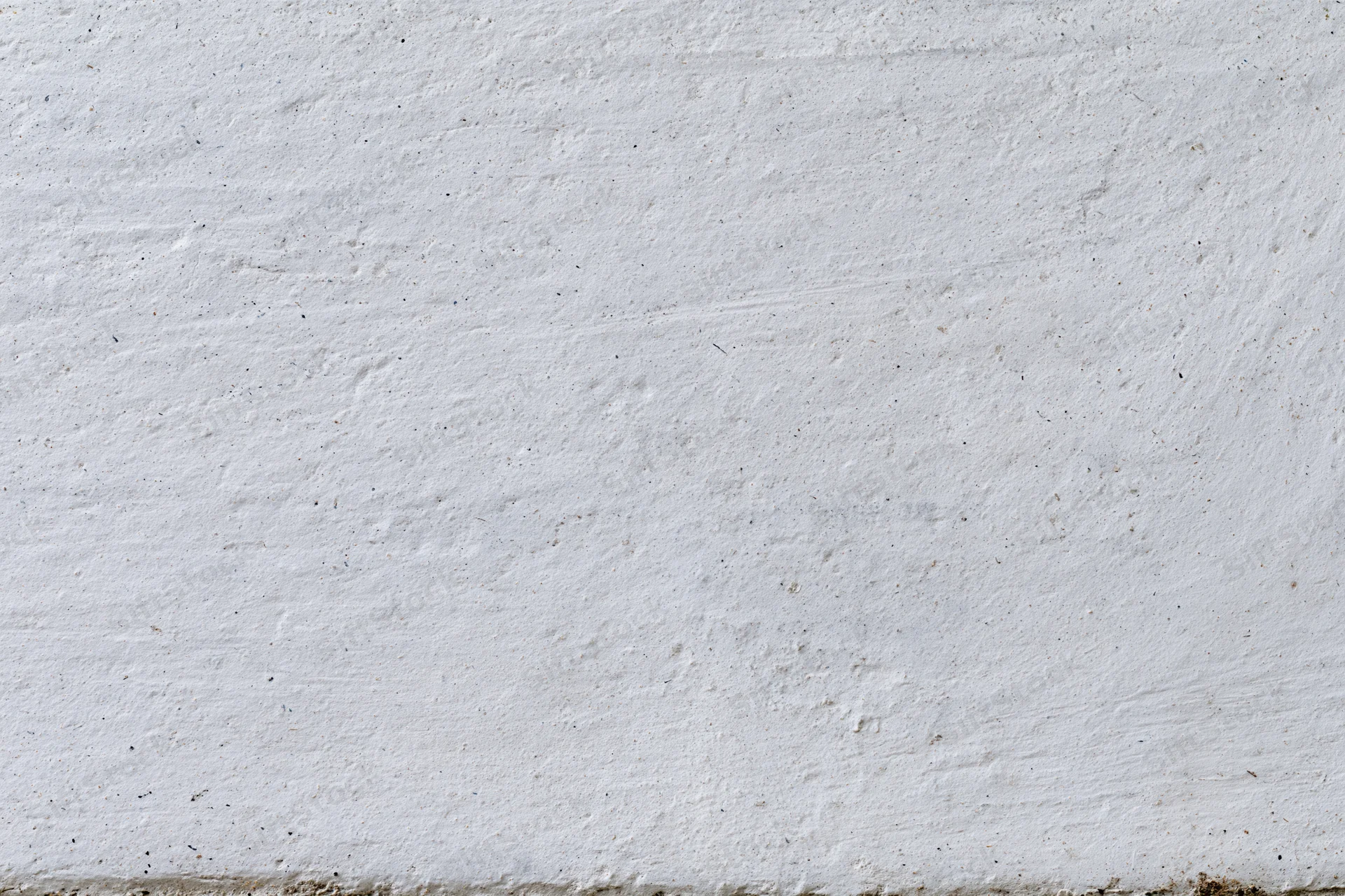 Flat concrete wall surface filling the entire frame with rough texture and neutral gray tone