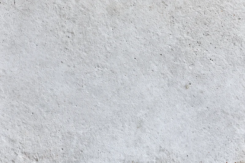 Flat concrete wall surface filling the frame with rough texture and gray tone