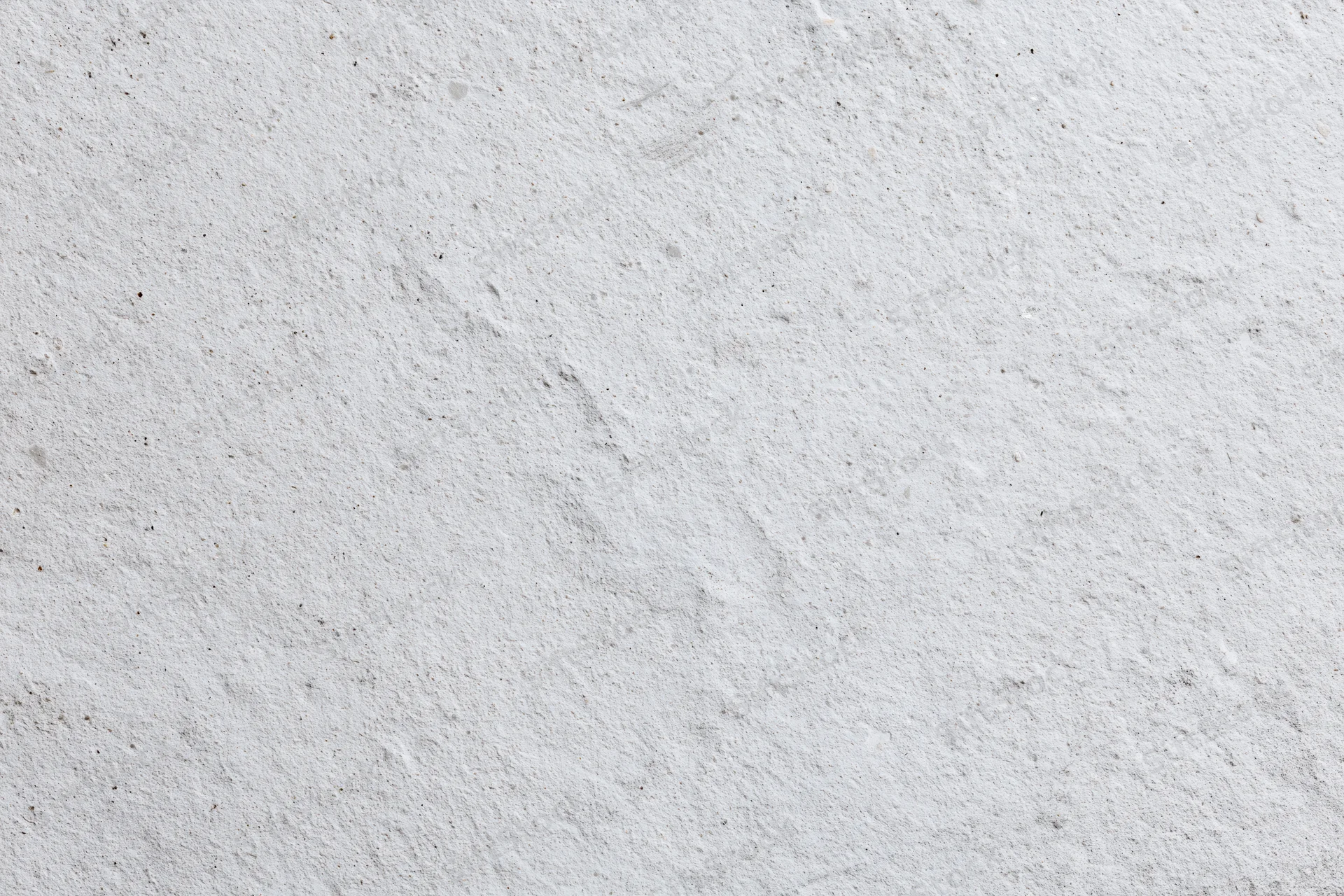 Flat concrete wall surface filling the frame with rough texture and neutral gray tone
