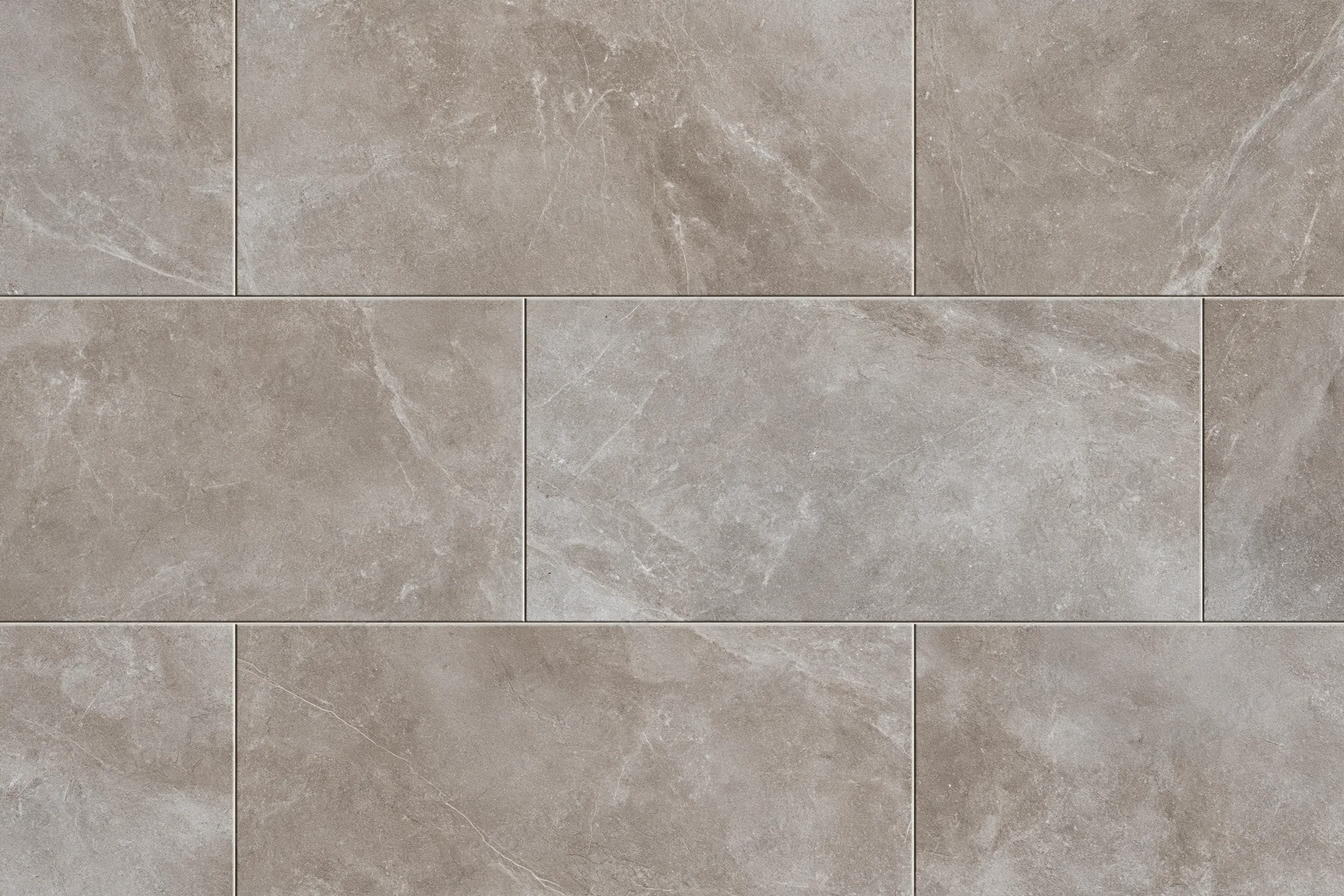 Large-format stone-look ceramic floor tiles arranged in a staggered pattern for interior flooring