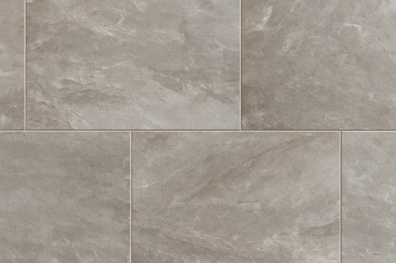 Large-format stone-look ceramic floor tiles arranged in a grid pattern for interior flooring