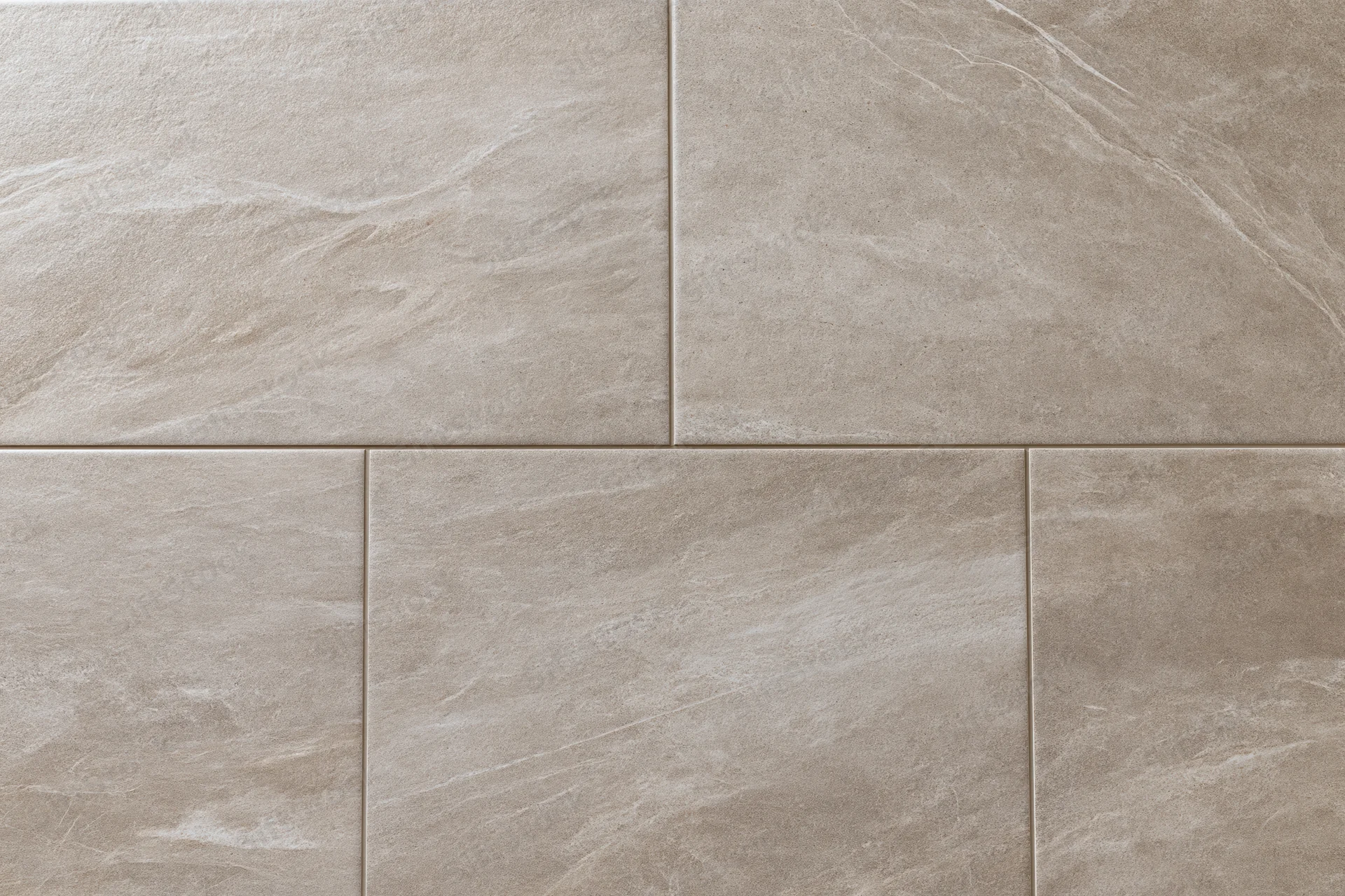 Large-format stone-look ceramic floor tiles arranged in a grid pattern for interior flooring