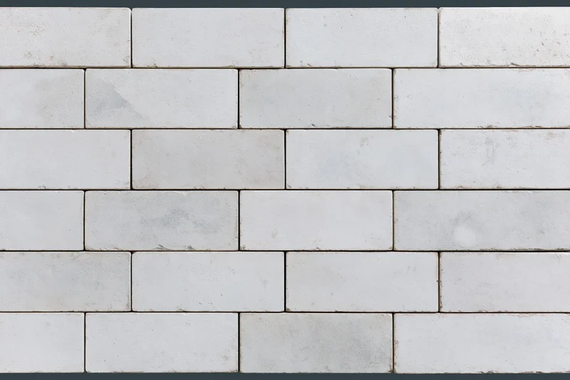Light grey concrete paving slabs arranged in a staggered pattern for outdoor flooring