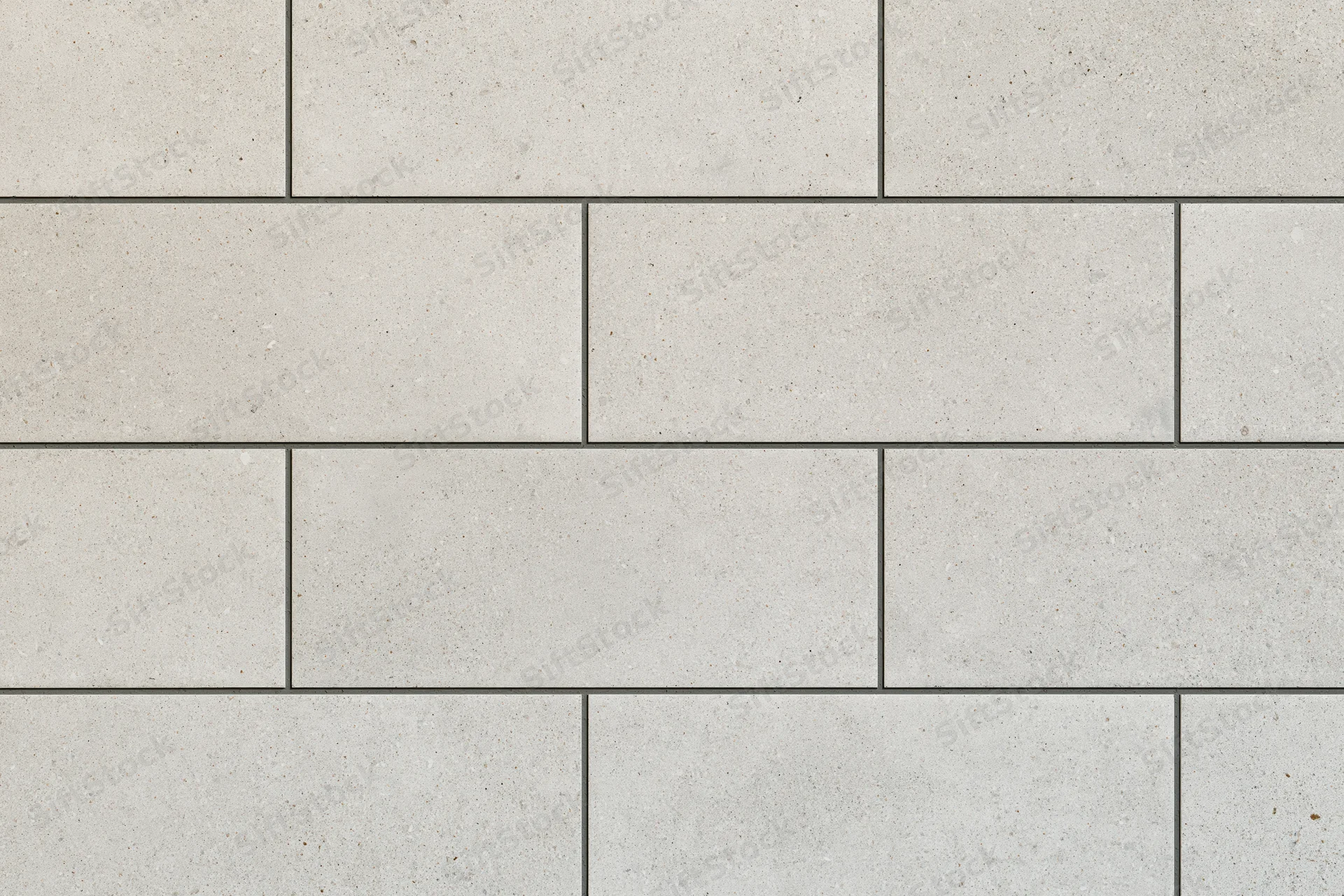 Large-format ceramic tiles arranged in staggered pattern for interior flooring
