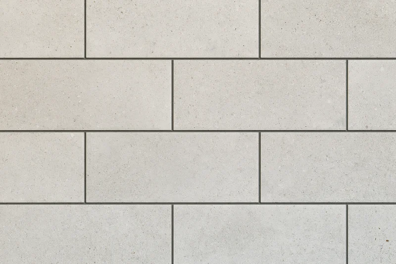 Large-format ceramic tiles arranged in staggered pattern for interior flooring