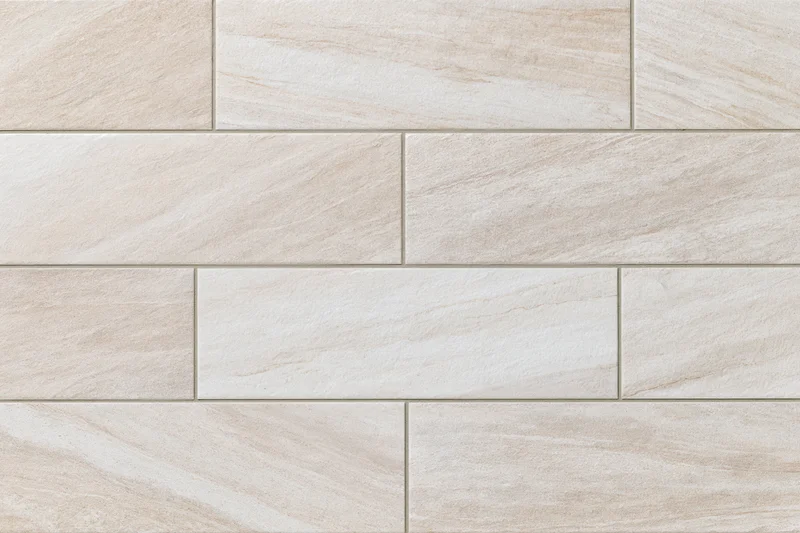 Large-format stone-look ceramic floor tiles arranged in a staggered pattern for interior flooring