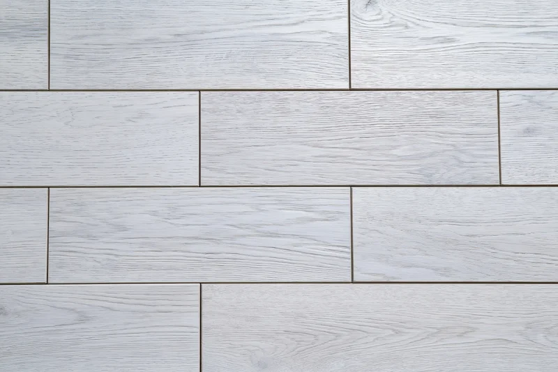 Light grey engineered oak hardwood flooring arranged in staggered planks for interior flooring
