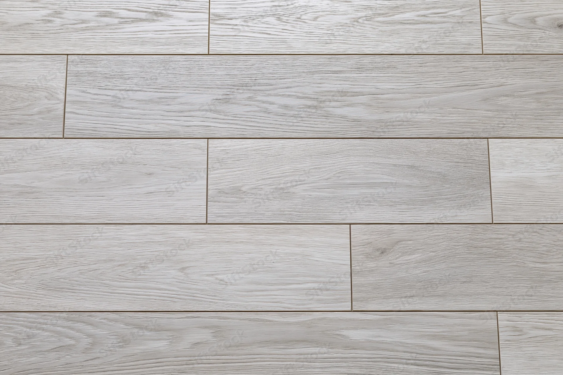 Light grey engineered oak hardwood flooring arranged in staggered planks for interior flooring