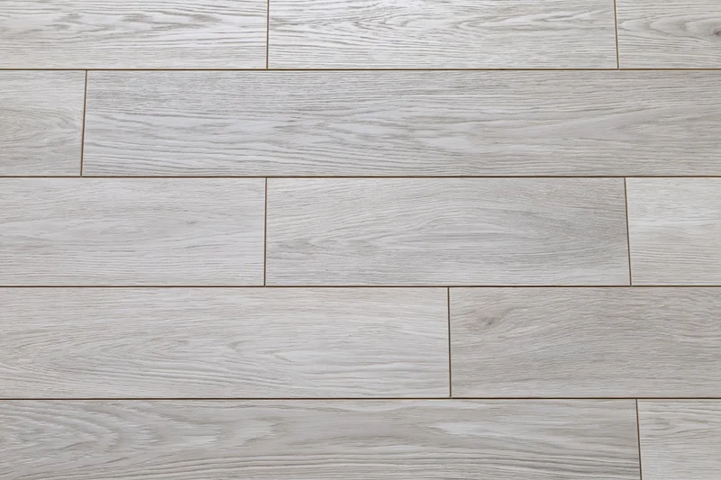 Light grey engineered oak hardwood flooring arranged in staggered planks for interior flooring