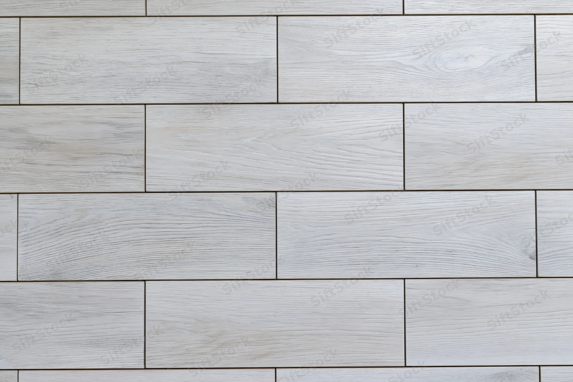 Light grey engineered oak hardwood flooring arranged in staggered planks for interior flooring