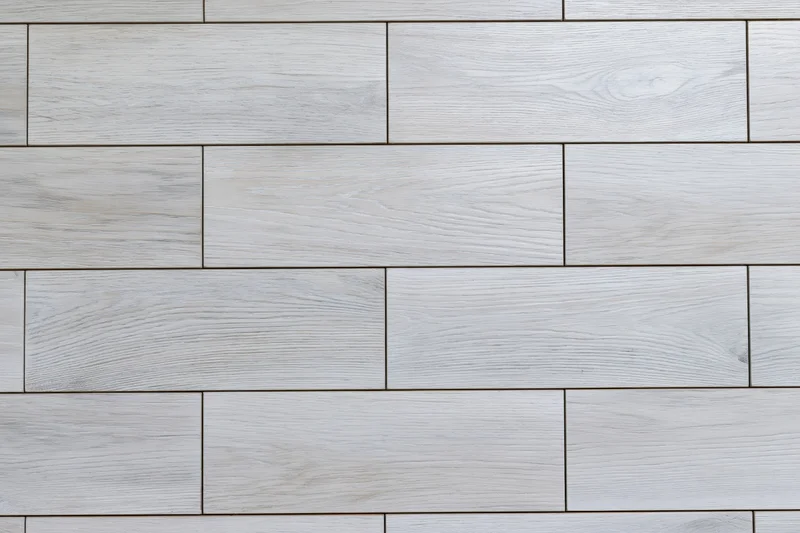 Light grey engineered oak hardwood flooring arranged in staggered planks for interior flooring