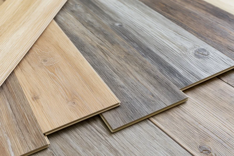 Wood flooring sample planks arranged diagonally on a display surface