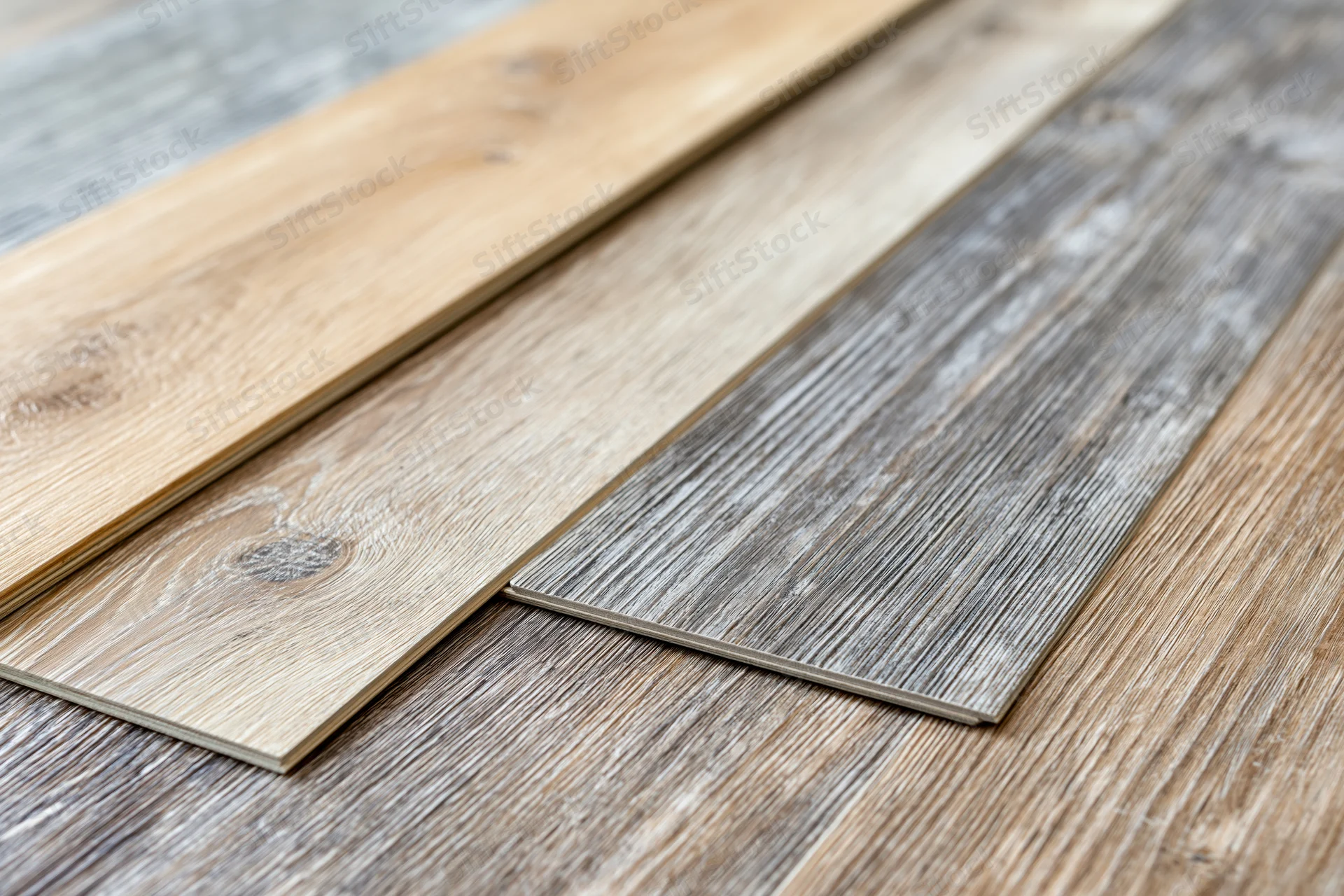 Wood flooring sample planks arranged diagonally in a fanned display