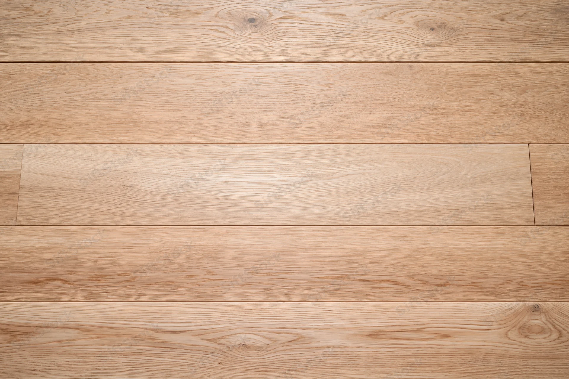 Overhead view of light oak hardwood floor planks arranged horizontally in a seamless pattern