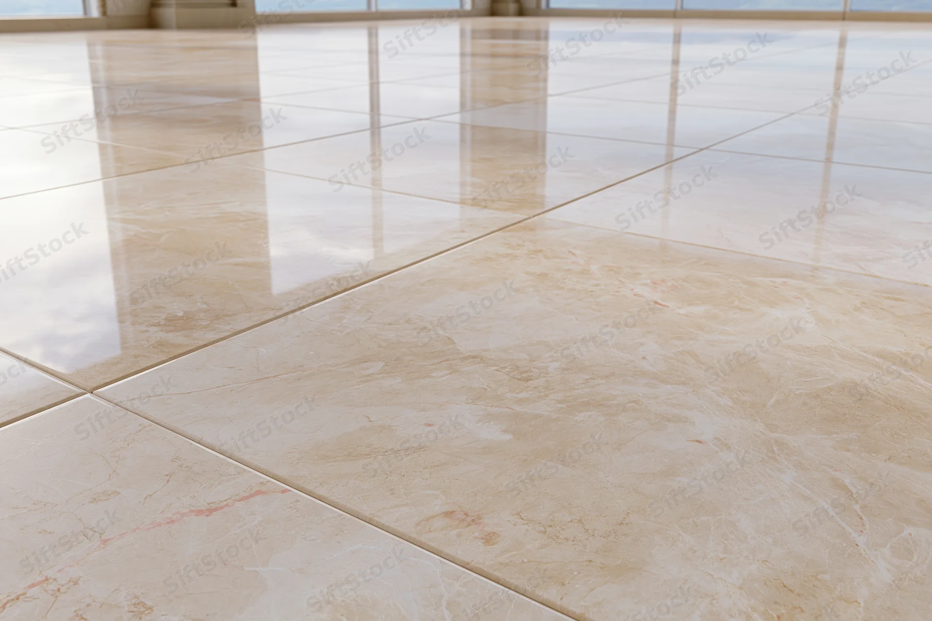 Polished marble tile floor reflecting light in a spacious interior