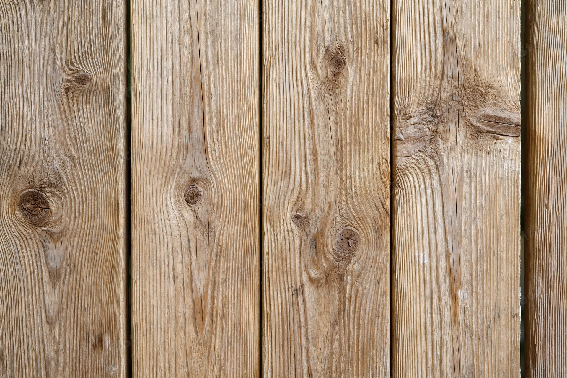 Vertical pine wood planks arranged flat-on filling the frame as a textured surface