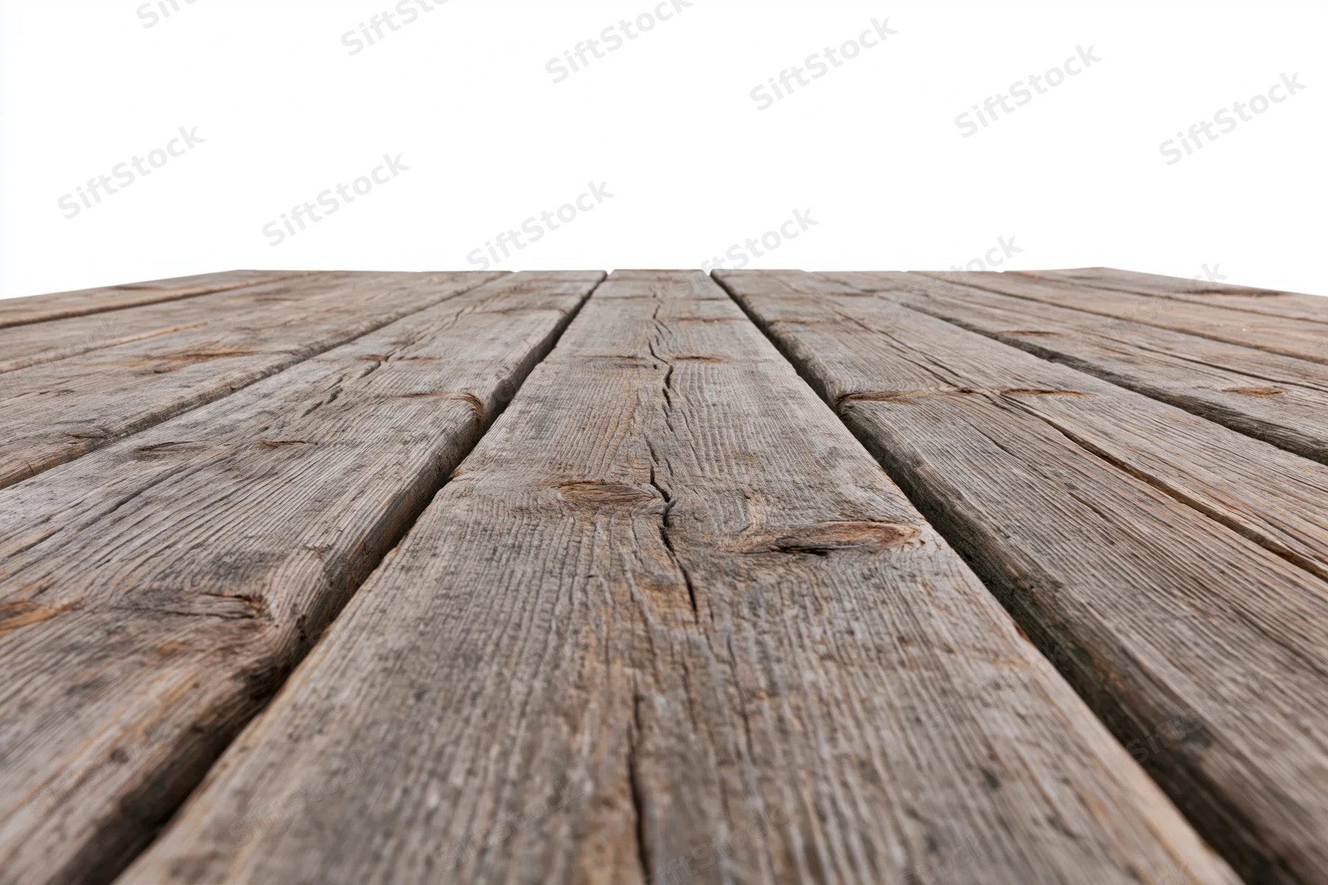 Weathered wooden deck planks receding into the distance on a white background