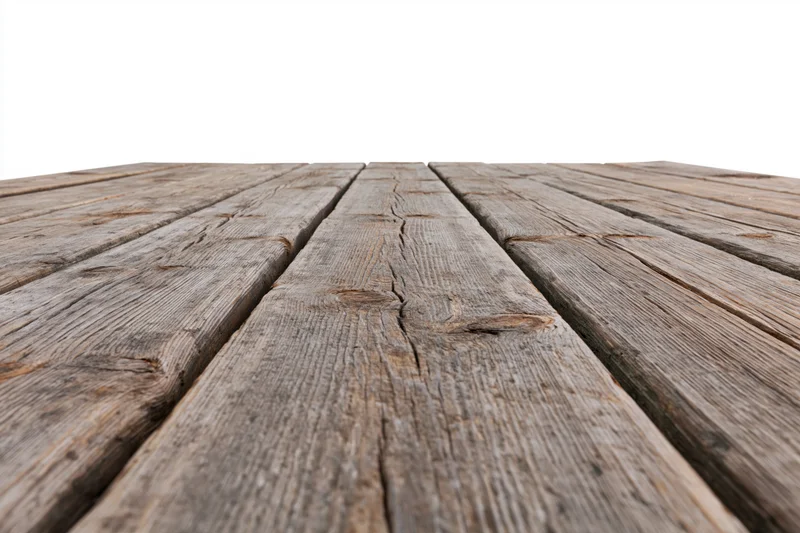 Weathered wooden deck planks receding into the distance on a white background
