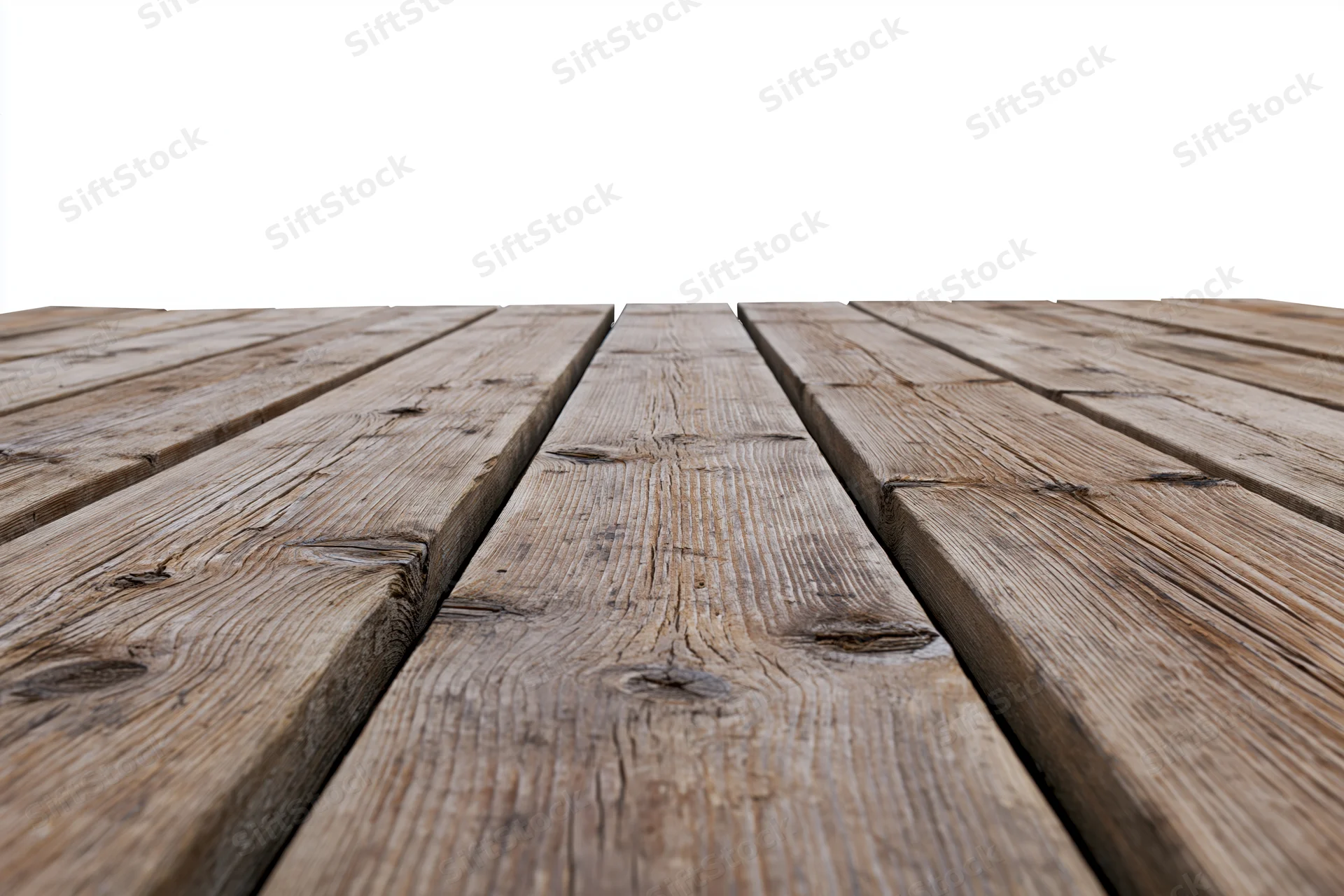 Weathered wooden deck planks arranged horizontally receding into the distance on a white background