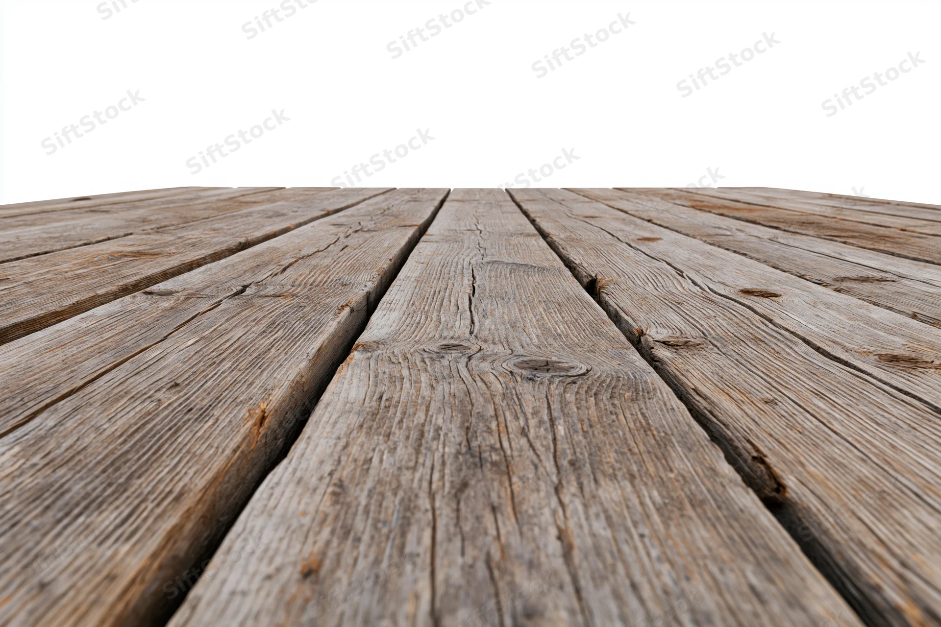 Weathered wooden deck planks arranged in parallel rows receding into the distance