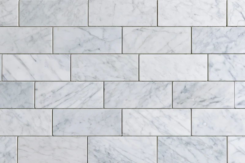 White marble tile wall surface filling the entire frame