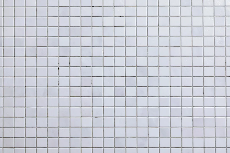 White small square mosaic tile wall surface filling the frame