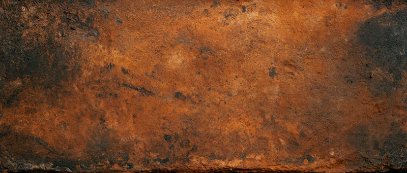 Close-up of a rusted metal surface with weathered texture and orange-brown patina