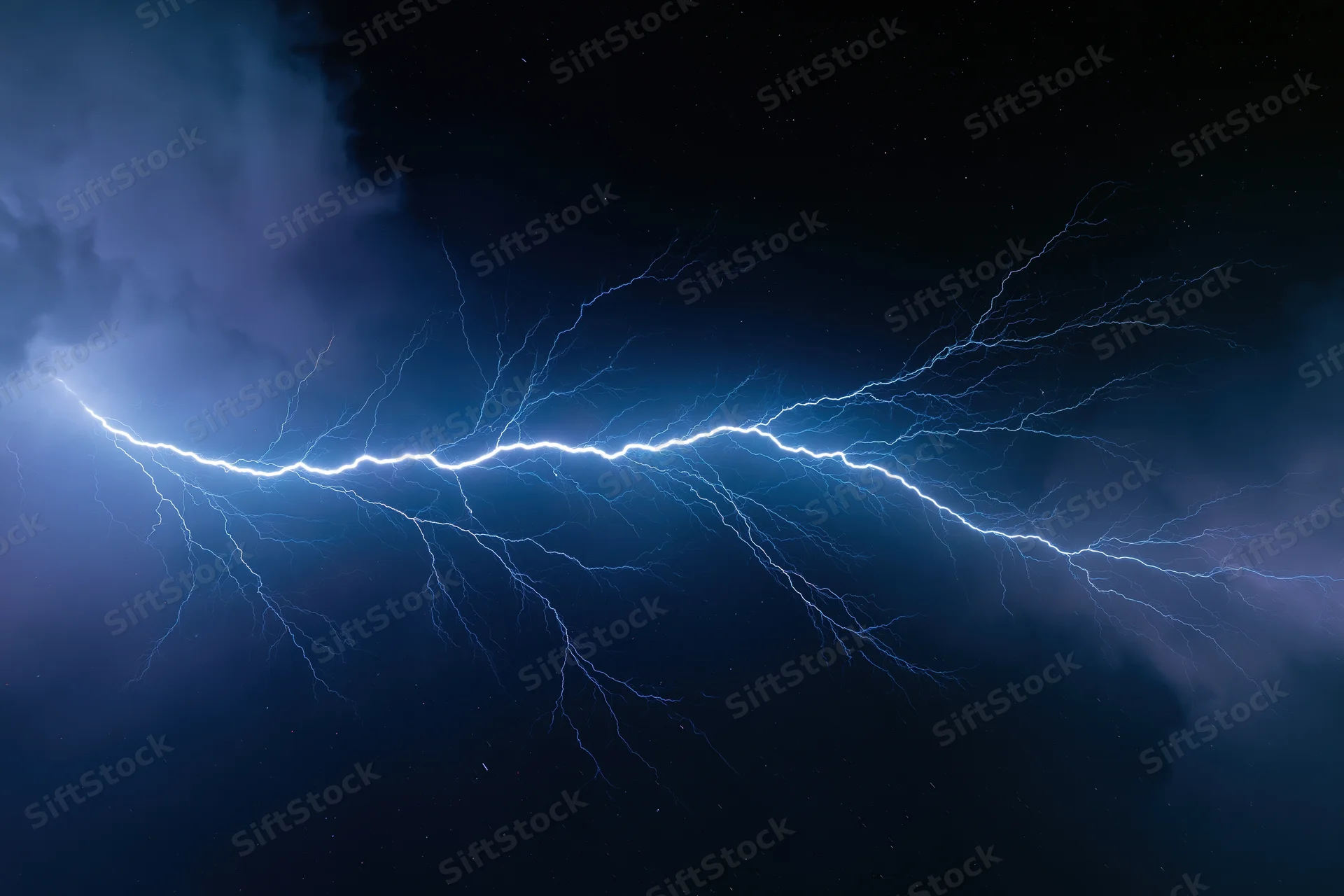 Jagged lightning bolt stretching horizontally across dark stormy sky at night