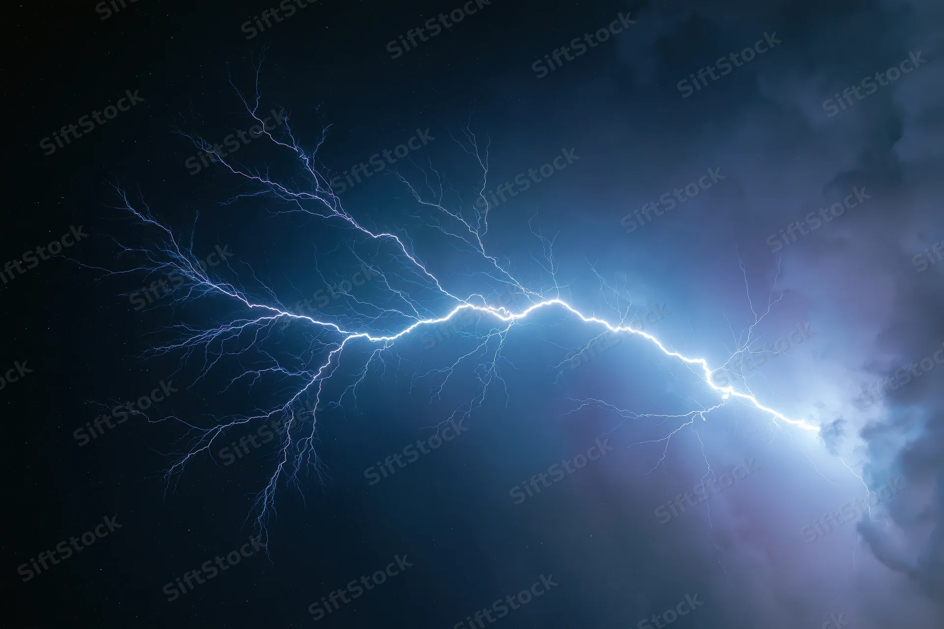 Jagged lightning bolt stretching horizontally across dark stormy sky at night