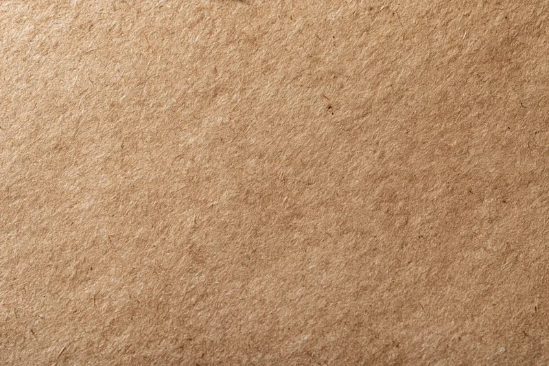 Close-up flat lay of a smooth kraft paper surface