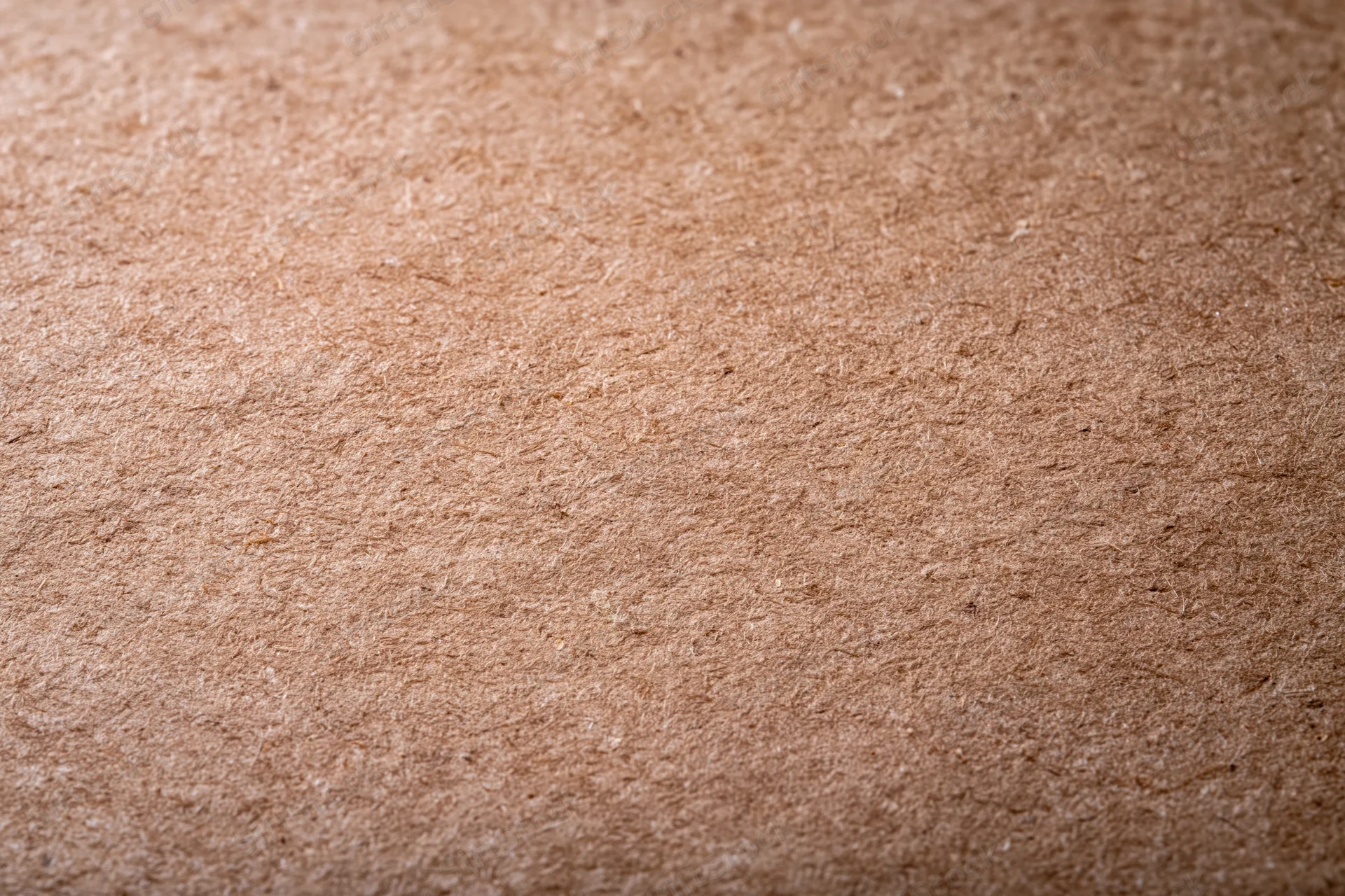 Close-up flat lay of smooth kraft paper surface