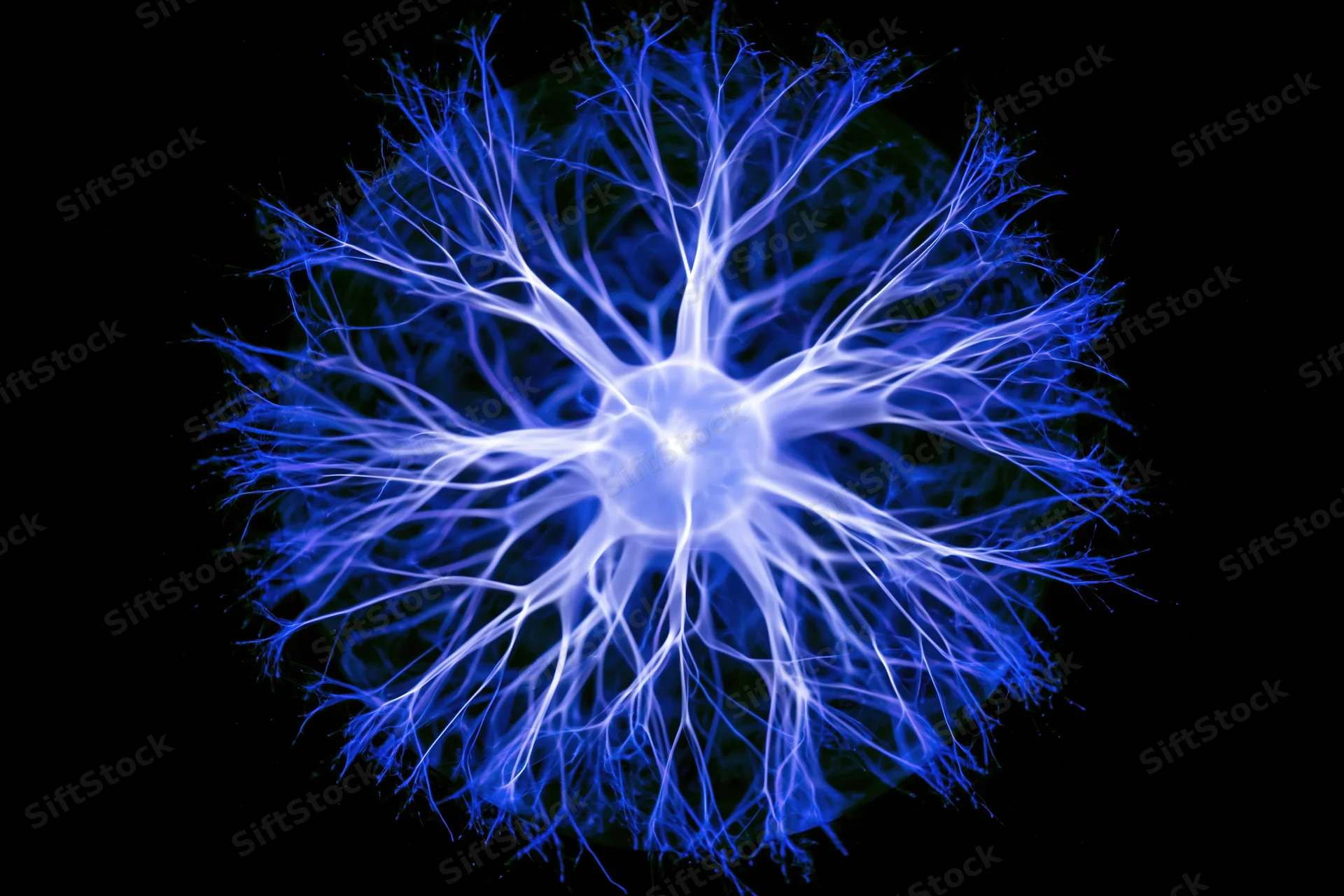 Plasma ball emitting blue electric filaments in a dark laboratory setting