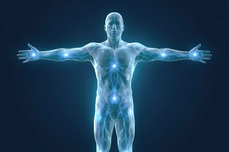 Translucent glowing male human body standing with arms outstretched against dark background