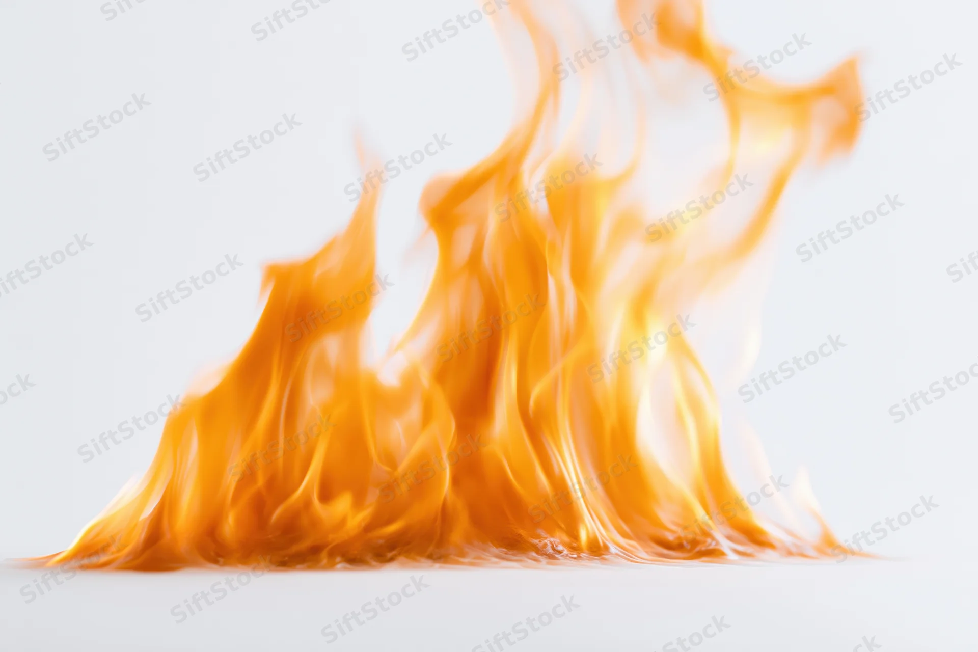 Flames burning steadily against a plain white background