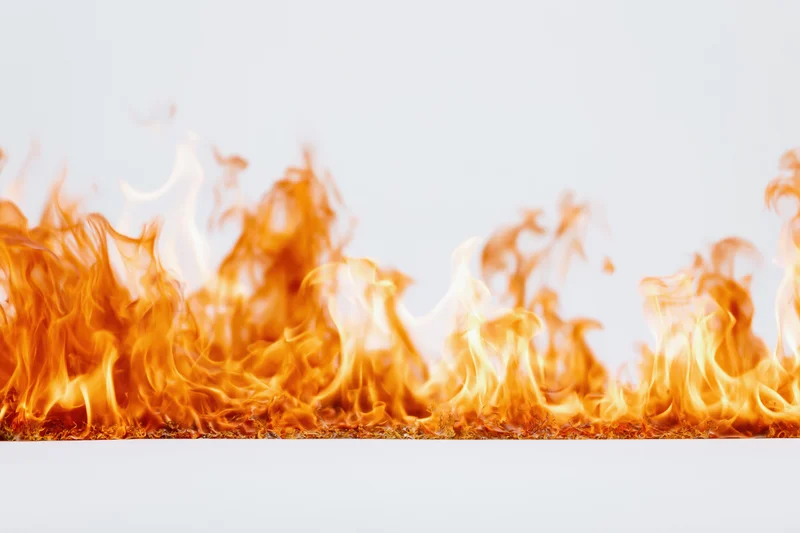 Flames burning steadily across the bottom of a white background with copyspace above