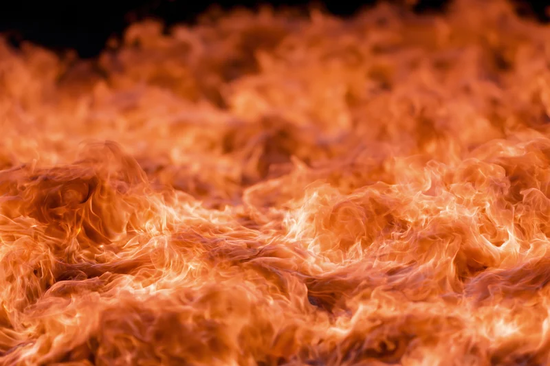 Close-up of roaring flames filling the frame with intense orange and red fire